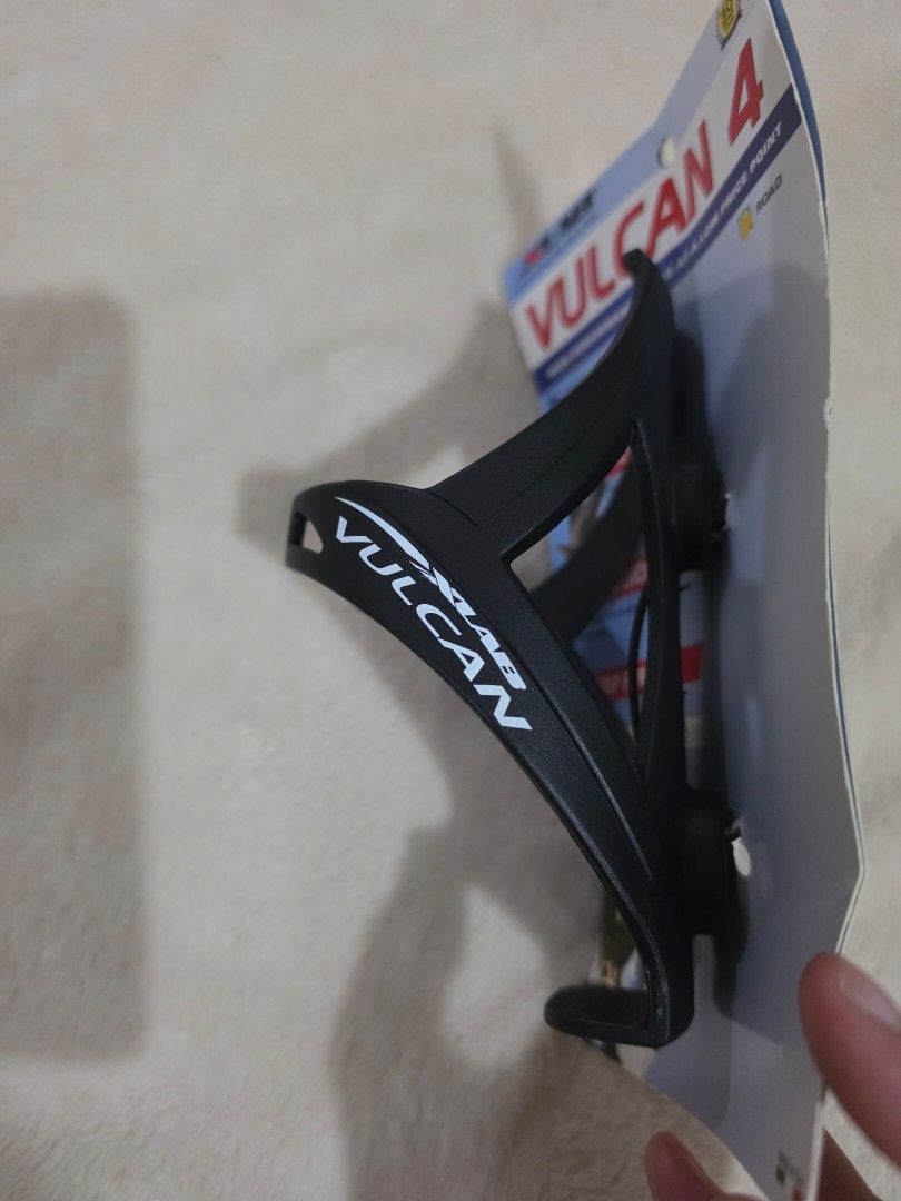 XLAB Vulcan 4 Water Bottle Cage (Category: Bicycles) located in Paranaque City. Submitted by krisfuentes (Listing ID 1439554740, Image 2). Description: - XLAB Vulcan 4 - Designed for high-performance cycling - Features: - Big bottom draw - Easy grip - Holds up to 4 lbs - Color: Black with white XLAB branding - Condition: New, with original packaging.