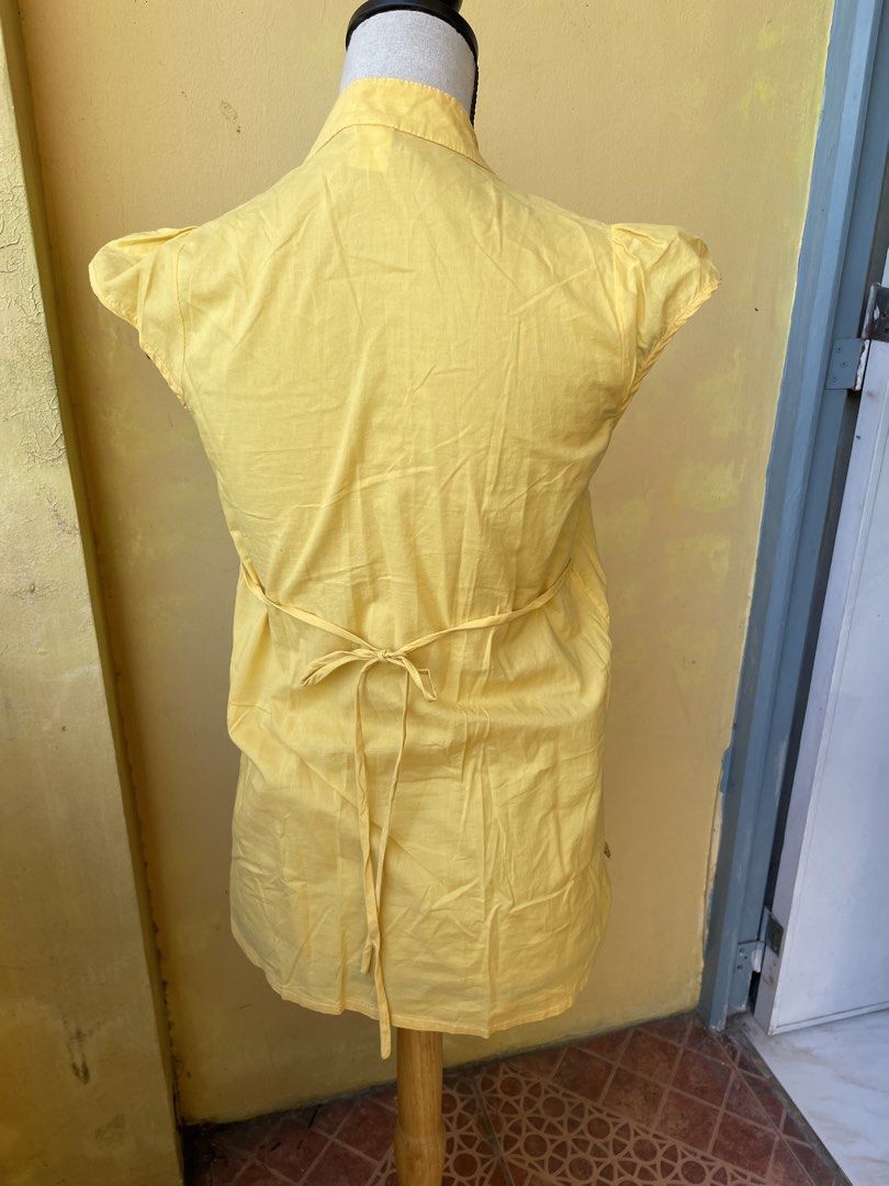 Yellow Embroidered Blouse (Category: Blouses) located in Pasig City. Submitted by khaleisi (Listing ID 1439502491, Image 2). Description: - Yellow blouse - Mandarin collar - Button-down front - Embroidered detailing - Short sleeves - Tie-waist back - Lightweight fabric - Suitable for warm weather - Simple and elegant - Bust 36” length 25”.