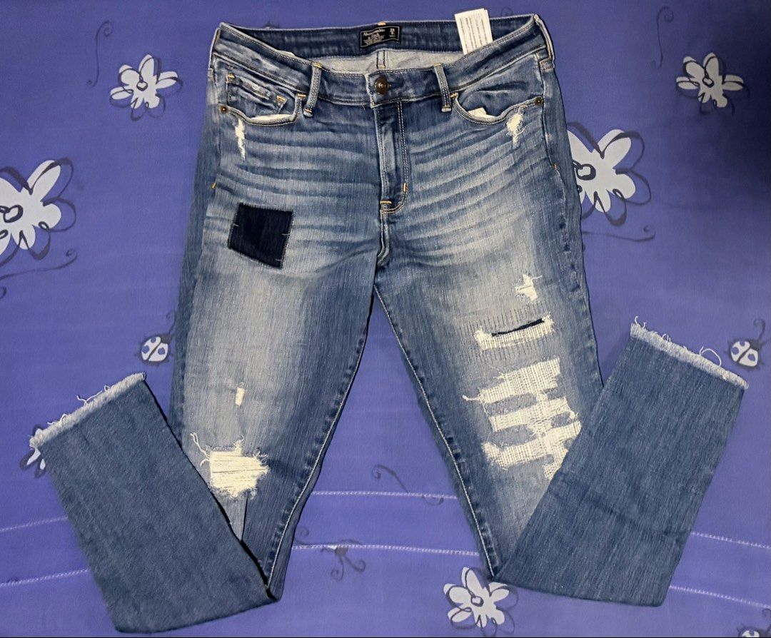 Abercrombie & Fitch Distressed Jeans (Category: Jeans) located in Manila. Submitted by urban.refinds (Listing ID 1439647015, Image 1). Description: - Abercrombie & Fitch distressed jeans - Classic five-pocket design - Button and zipper closure - Mid-rise waist - Slim fit - Distressed details: patches, frayed hems - Medium blue wash with fading - Size 29.