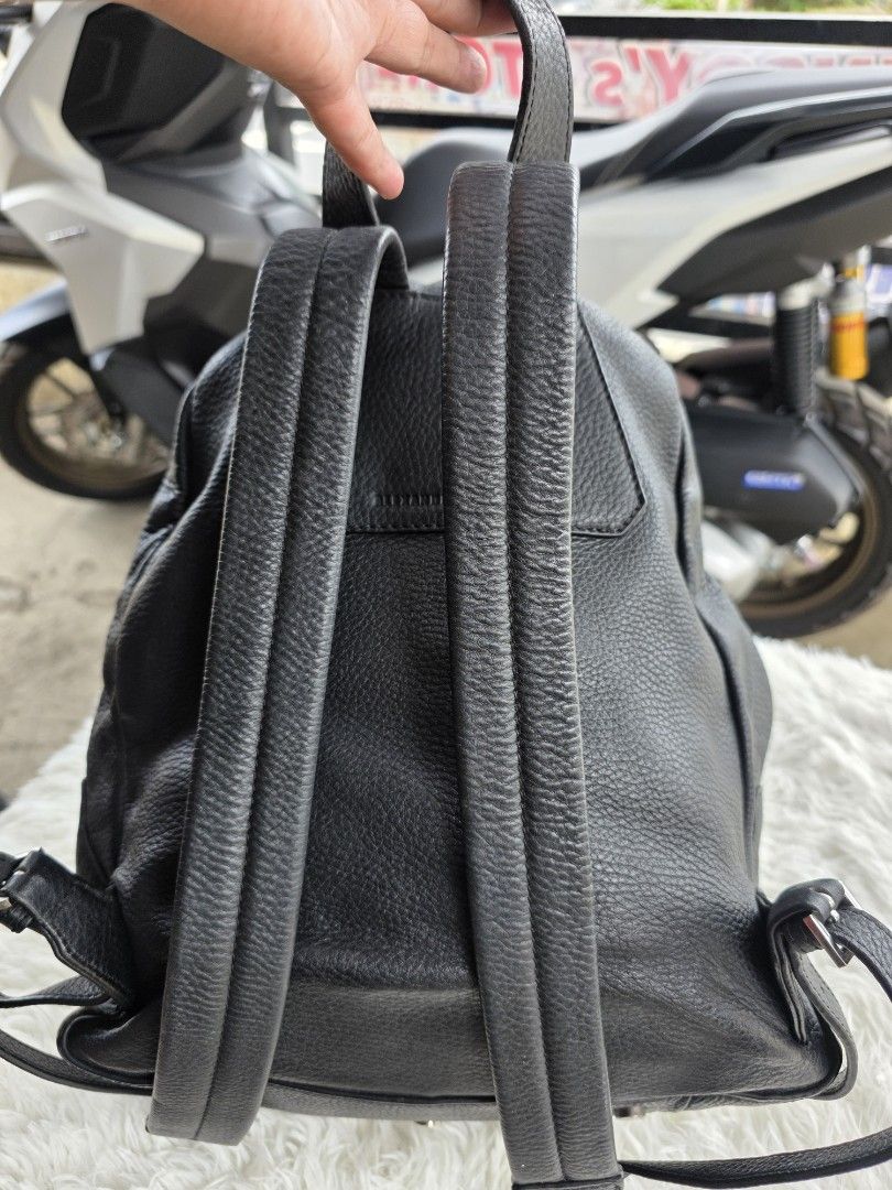 Alexander Wang Crux Backpack (Category: Luxury Bags & Wallets) located in Lemery. Submitted by venus23 (Listing ID 1439700492, Image 3). Description: - Black Alexander Wang Crux backpack - Front pocket with silver-tone metal accent - Top handle - Adjustable straps - Metal feet on the bottom - Zipper closure - Brand name embossed on the back.