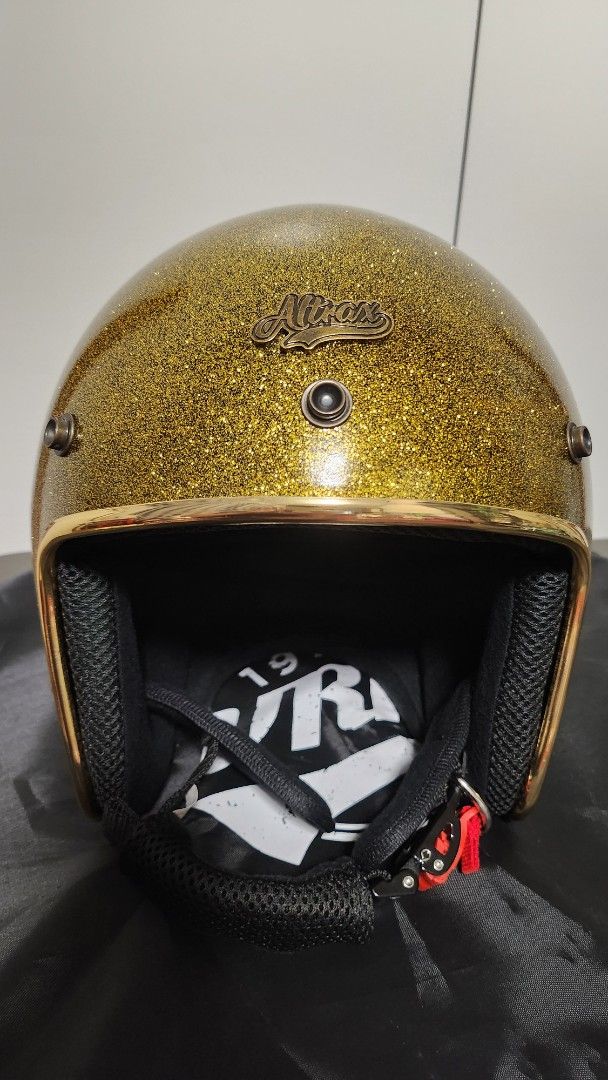 Altrax VRM Gold Glitter Motorcycle Helmet (Category: Helmets and other Riding Gears) located in Manila. Submitted by jmgco (Listing ID 1439797203, Image 2). Description: Altrax Gold Glitter Helmet bought from VRM Vintage Rider Manila SRP: 6,295 Selling Price: 5,300 Size XL Good as new Comes with peak, original box and bag Gold Glitter color with ICC sticker Purchased May 2, 2026 RFS: too many helmets, impulse buying .