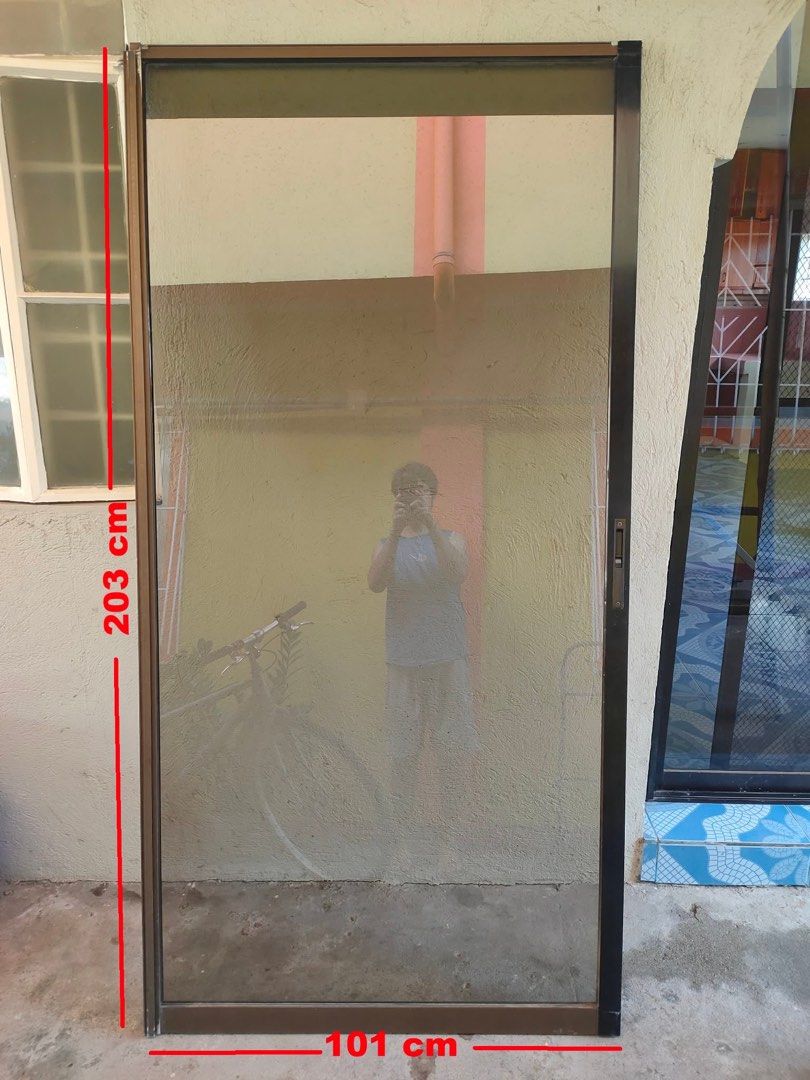 Aluminum Screen & Glass Door (Category: Other Home Furniture) located in Las Pinas. Submitted by jemsells (Listing ID 1439756980, Image 2). Description: 2 glass door and 1 screen - Aluminum screen door - Dark frame - Dimensions: 101cm wide x 203cm tall - Mesh screen - Ready for installation - Ideal for doorways - Allows airflow while keeping insects out.