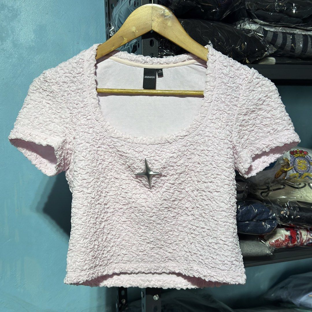 Annakiki Pink Textured Crop Top (Category: Blouses) located in Cavite. Submitted by gooditems.cavite (Listing ID 1439753136, Image 2). Description: - Annakiki crop top - Size: M 15.5x17 stretchable fabric - Color: Light Pink - Features: Scoop neckline, short sleeves, star embellishment, textured fabric - Condition: Brand new with tag.