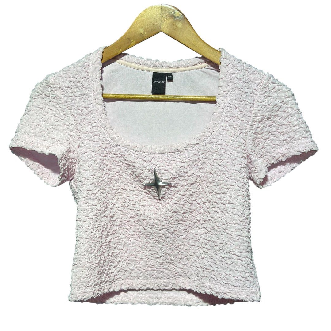 Annakiki Pink Textured Crop Top (Category: Blouses) located in Cavite. Submitted by gooditems.cavite (Listing ID 1439753136, Image 1). Description: - Annakiki crop top - Size: M 15.5x17 stretchable fabric - Color: Light Pink - Features: Scoop neckline, short sleeves, star embellishment, textured fabric - Condition: Brand new with tag.