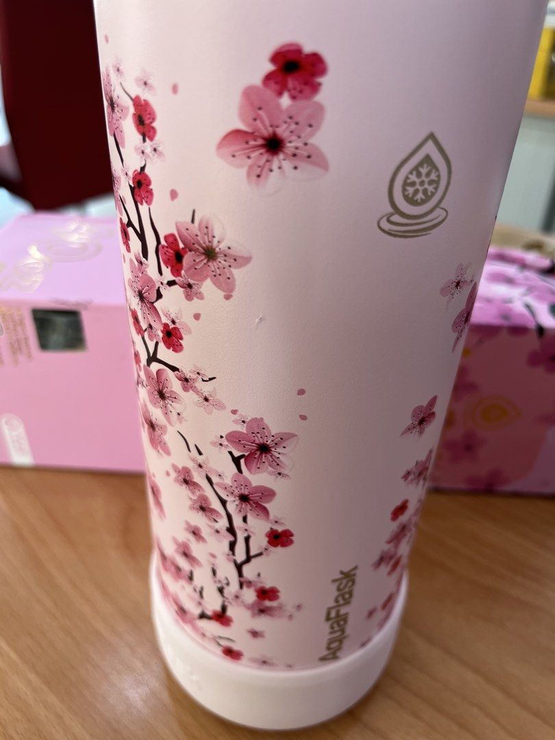 AquaFlask Sakura 40oz Water Bottle (Category: Water Bottles & Tumblers) located in Legazpi City. Submitted by mblangcauon (Listing ID 1439653517, Image 3). Description: - AquaFlask 40oz water bottle - Pink color with Sakura design - Keeps drinks cold - Features a handle on the lid - Comes with original box.