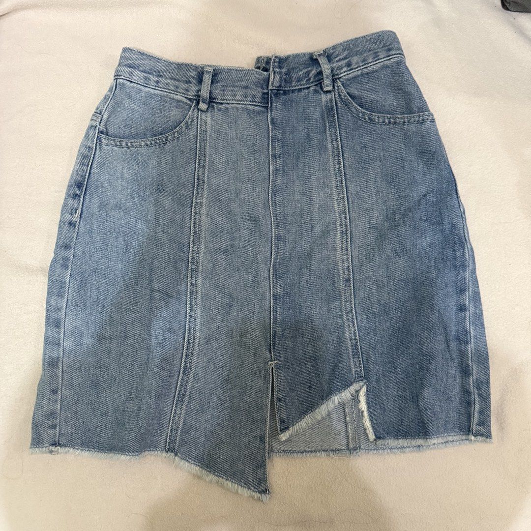 Asymmetrical Two tone Denim Skirt with Front Slit (Category: Skirts) located in Manila. Submitted by miss.v.declutter (Listing ID 1439769812, Image 1). Description: - Light blue denim skirt - Unique front slit design - Classic five-pocket style - Raw hem detail - Back zipper closure - Color block design at the back.