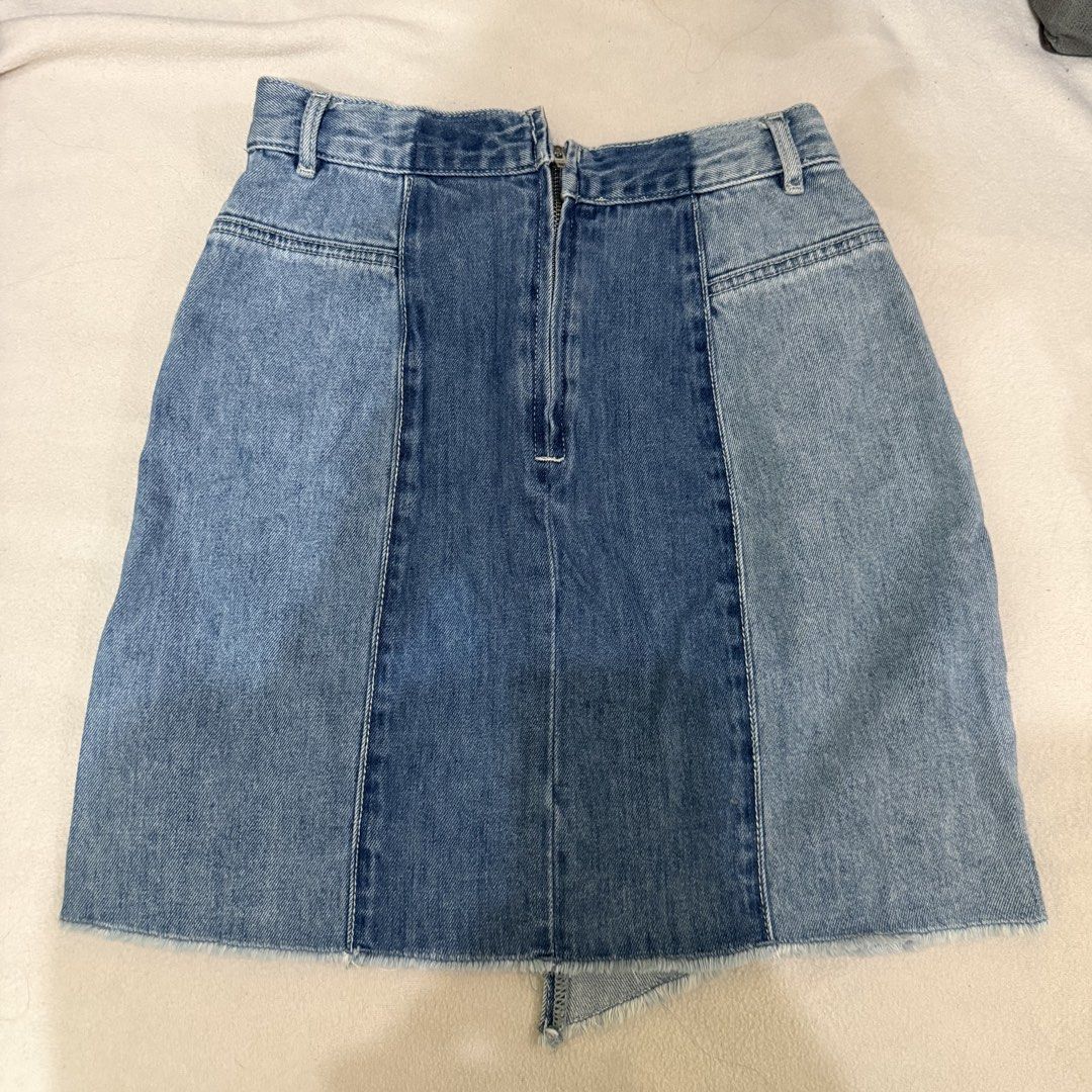 Asymmetrical Two tone Denim Skirt with Front Slit (Category: Skirts) located in Manila. Submitted by miss.v.declutter (Listing ID 1439769812, Image 2). Description: - Light blue denim skirt - Unique front slit design - Classic five-pocket style - Raw hem detail - Back zipper closure - Color block design at the back.