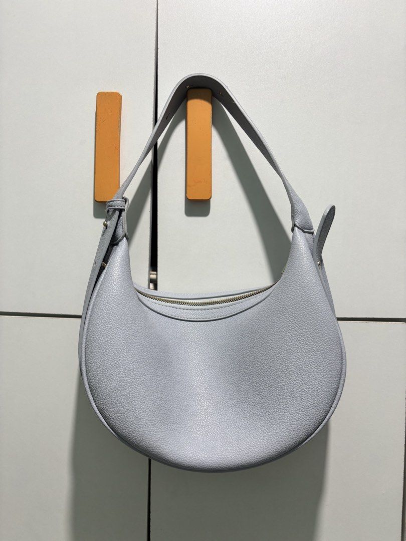[AUTHENTIC 💯] Bostanten Light Blue Moon Bag (Category: Shoulder Bags) located in Manila. Submitted by codeofethixx (Listing ID 1439694508, Image 2). Description: PRICE IS FIXED ⭕️ NO HAGGLING AND NO TO SENSITIVE BUYER ❌ Pls check pics for condition po. This is a preloved bag, pls manage your expectations :)) Let’s not waste each other’s time po if hindi sure buyer Mode of Payment: Any - transfer to my GoTyme account I can ship same day immediate