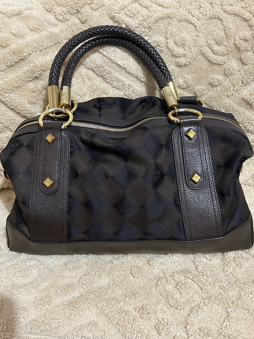Authentic vintage MCM jacquard boston type bag (Category: Luxury Bags & Wallets) located in Cebu City. Submitted by vedazzle (Listing ID 1439753794, Image 1). Description: 📍In very good vintage condition, clean interior, minor signs of use only. 📍A timeless classic piece for everyday luxury. Very spacious and functional 📍Nylon/jacquard body with leather trim and braided handles ✅ Clean Interior & Exterior fabric ✅ Handles still nice ✅ Hardware