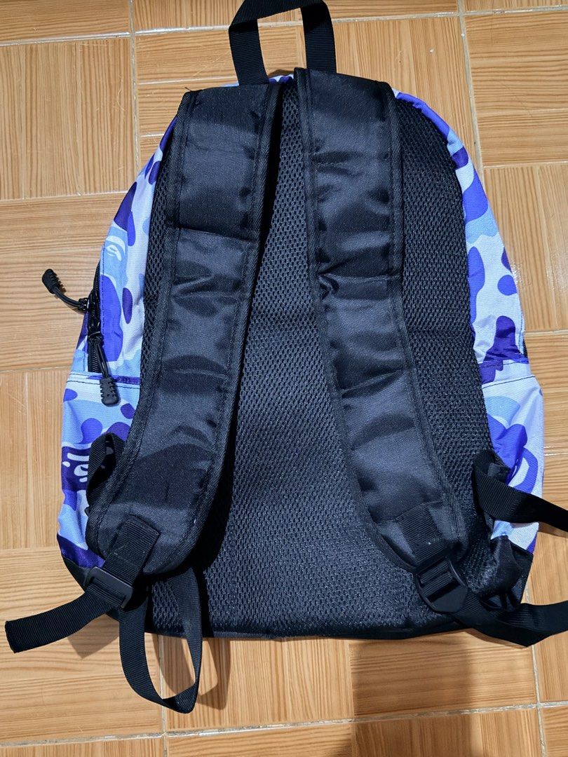 BAPE Camo Backpack (Category: Backpacks) located in Manila. Submitted by calmstar_006f69 (Listing ID 1439696047, Image 2). Description: - Authentic BAPE backpack - Eye-catching blue camouflage design - Spacious main compartment - Convenient front pocket with BAPE logo - Comfortable black back and straps - Made from durable material - Perfect for books, laptops, and daily essentials.