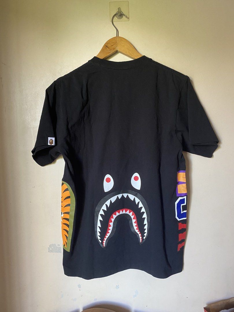 BAPE Shark Tee Black Medium (Category: Tshirts & Polo Shirts ) located in Calapan. Submitted by yowstuff (Listing ID 1439609394, Image 2). Description: - Authentic BAPE T-shirt - Black color - Size: Medium - Features the iconic shark and tiger design - Made of 100% cotton - Includes BAPE tags - Crew neck and short sleeves.