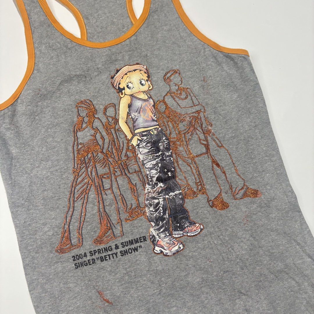 Betty Boop Tank Top (Category: Sleeveless) located in Cebu City. Submitted by kidfrom6000 (Listing ID 1439770442, Image 3). Description: Gray tank top featuring a Betty Boop graphic. It has an orange trim and a racerback design. The graphic includes the text "2004 Spring & Summer Singer 'Betty Show'". The tag indicates a size 12. Dimensions can be seen in the picture.