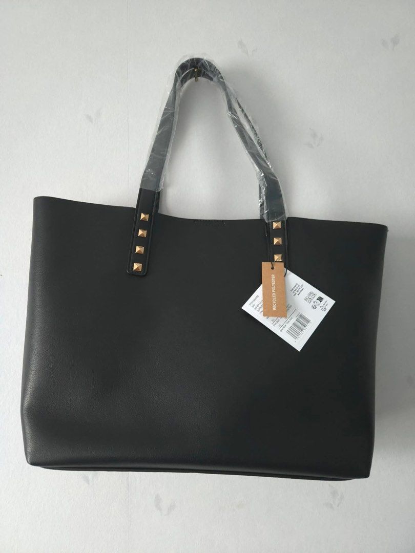 Even & Odd Black Tote Bag with Studs (Category: Tote Bags) located in Manila. Submitted by corryyy (Listing ID 1439632105, Image 2). Description: - Bought from Finland - lightweight -Stylish black tote bag - Contrasting red interior - Gold-colored stud accents on handles - Interior pocket with snap closure - Spacious design - Perfect for everyday use - Comes with tag.