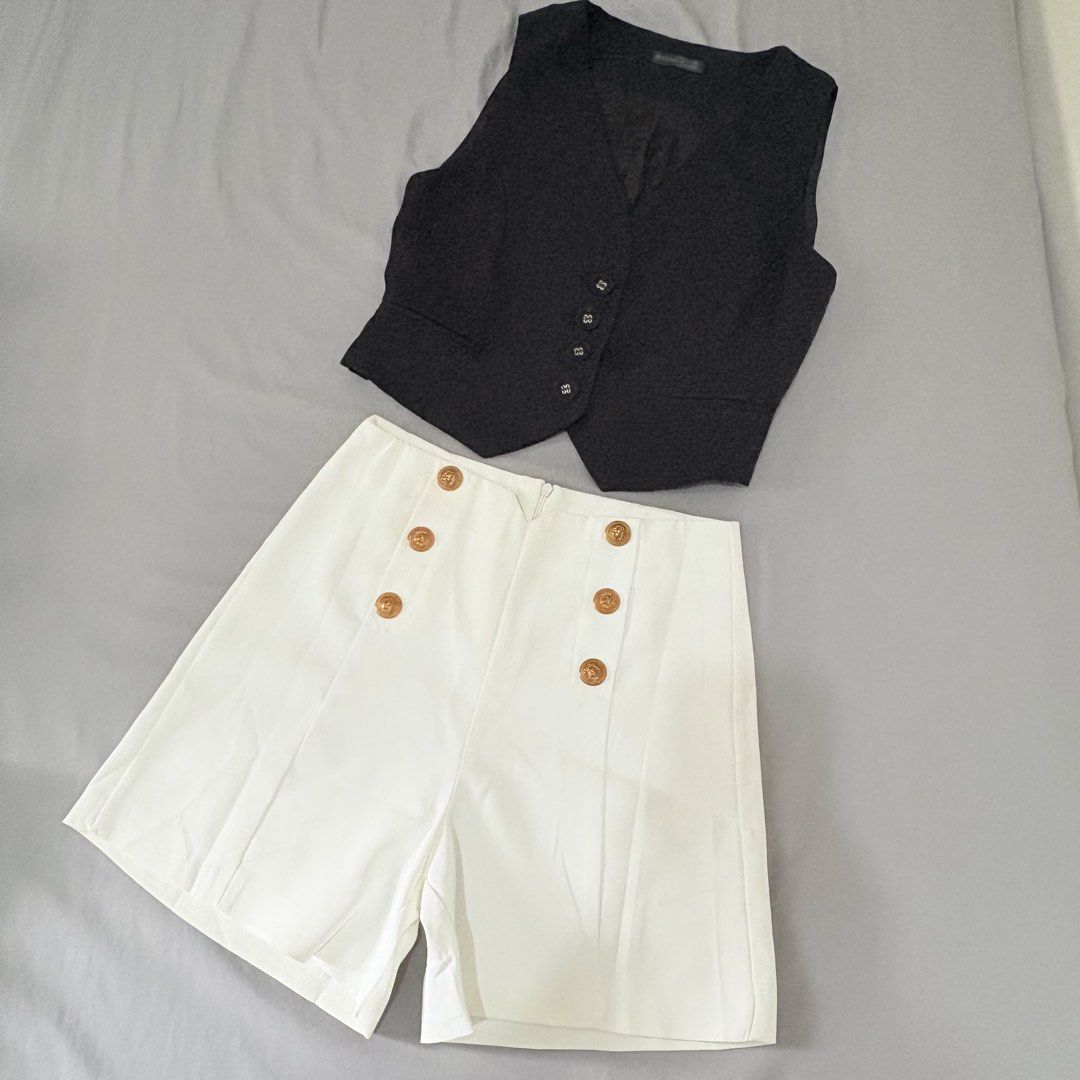 Black Vest and White Shorts Set (Category: Sets or Coordinates) located in Quezon City. Submitted by mae_iggy (Listing ID 1439698936, Image 3). Description: - Stylish black vest - Paired with high-waisted white shorts - Vest features a button-down design - Shorts have decorative buttons - Perfect for a chic and versatile look - Great for casual outings or special occasions - A fashionable wardrobe addition.
