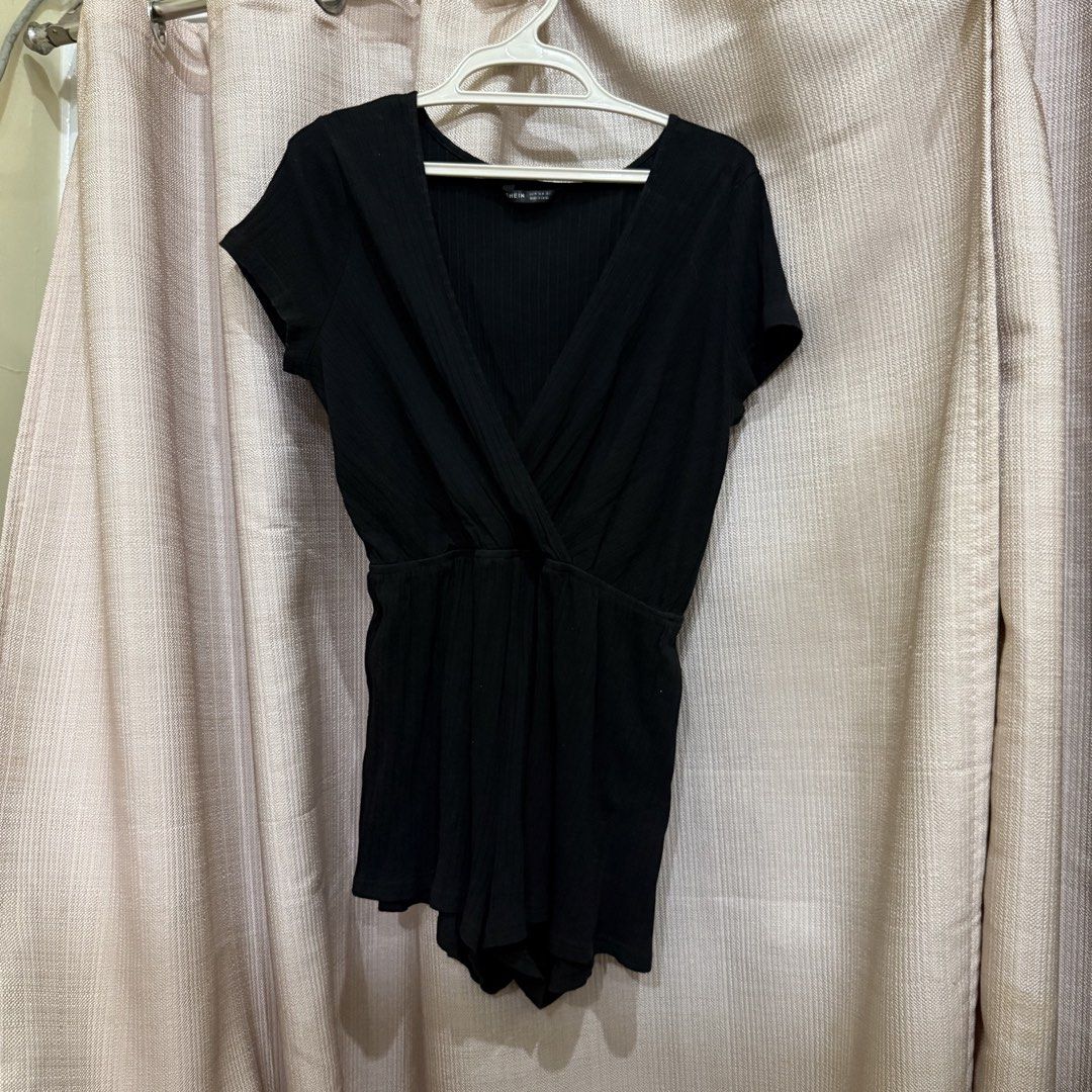 Black Wrap Romper (Category: Rompers) located in Manila. Submitted by miss.v.declutter (Listing ID 1439769725, Image 1). Description: - Black wrap romper (shorts) - Short sleeves - V-neck design - Cinched waist - Ribbed fabric - Stylish and comfortable.