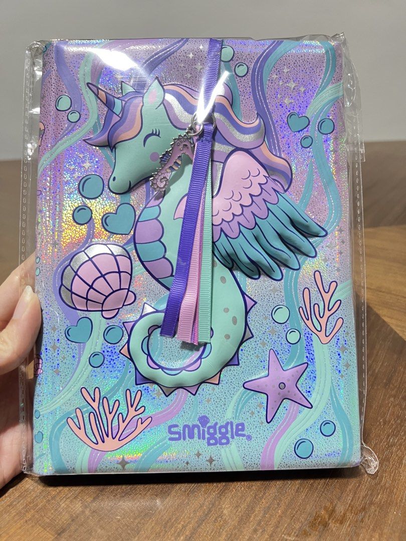 BN Smiggle Epic Adventures Notebook with Lucky Charm Bookmark Unicorn Seahorse Shiny Iridescent Blue Pink Purple Lined Note book Cute Design for Girls Kids Birthday Gift Authentic SMIGGLE product Promotional Deal (Category: Stationery & School Supplies) located in Singapore. Submitted by ywl33 (Listing ID 1439753319, Image 2). Description: ✨ Brand New in Original Smiggle Packaging 😍 Great as a gift for Unicorn lovers • Smiggle A5 Notebook featur