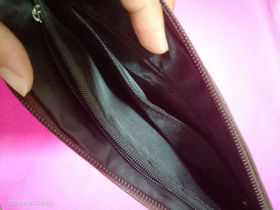 Brown Crossbody Bag/Clutch (Category: Cross-body Bags) located in Binan City. Submitted by criscb (Listing ID 1439646747, Image 2). Description: * Monogram print with multiple zipper compartments. Note: The sling/strap has some slight damage (reflected in the low price!), but it can easily be used as a clutch or swapped out with any standard clip-on strap you already own. * With front & back zipper.