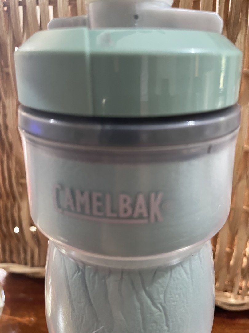 Camelbak Podium 21oz Water Bottle (Category: Water Bottles & Tumblers) located in Quezon City. Submitted by hopezam.374 (Listing ID 1439720758, Image 3). Description: Camelbak Podium water bottle with a 21oz / 620ml capacity. Features a light green body and a gray cap. The bottle is marked with the Camelbak and Podium logos. The cap has a leak-proof design. .
