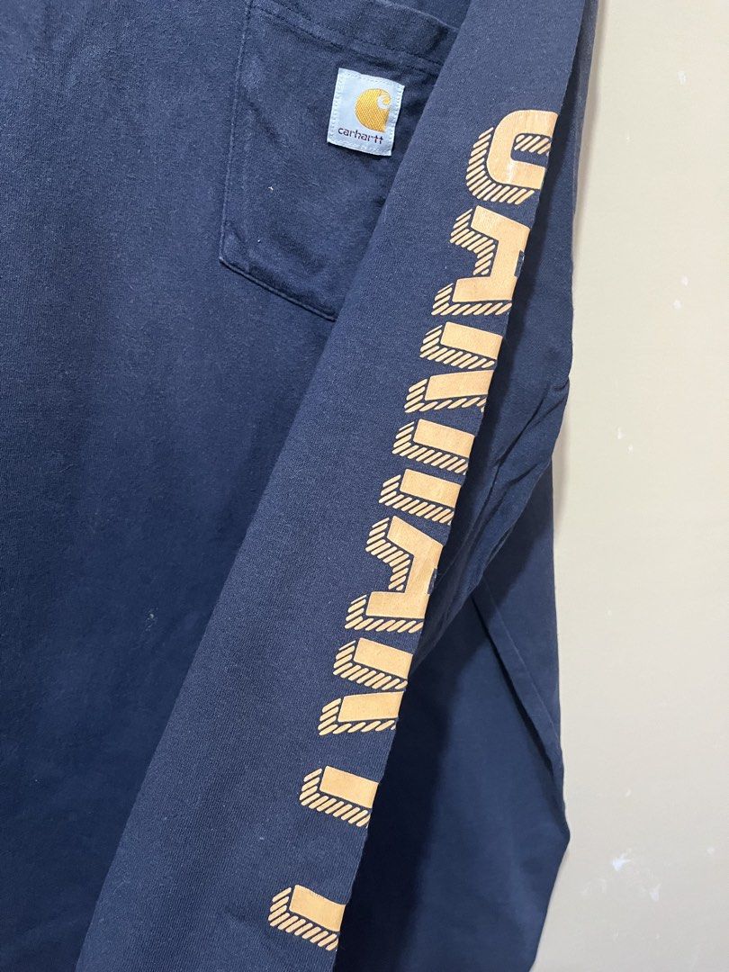 Carhartt Long Sleeve Shirt (Category: Tshirts & Polo Shirts ) located in Calamba. Submitted by jdot999 (Listing ID 1439653017, Image 3). Description: Carhartt long sleeve shirt with a pocket on the chest. Features the Carhartt logo on the pocket and sleeve. The shirt is a dark navy blue color. The second shirt is a maroon color with a button-up collar and a pocket on the chest with the Carhartt logo. 1500 aspack.