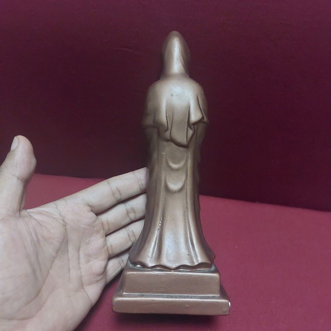 Ceramic Guan Yin Statue (Category: Religious Items) located in Pasig City. Submitted by carls_vintages (Listing ID 1439792995, Image 2). Description: - Ceramic Guan Yin statue - Intricate details - Rectangular base with Chinese characters - Green felt lining on the base - Standing pose with clasped hands.