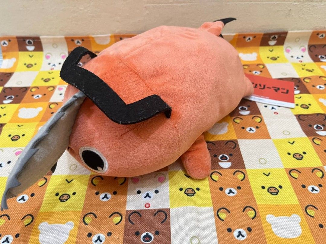 Chainsaw Man Pochita Plush Toy (Category: Plushies & Soft Toys) located in Bulacan. Submitted by arax_kumashop (Listing ID 1439673573, Image 3). Description: - Adorable Pochita plush toy from Chainsaw Man. - Features Pochita's signature chainsaw head and orange body. - Soft and huggable material. - Perfect for cuddling or display - Includes original tag. - A great addition to any anime collection! -bought 1k japan pasabuy.