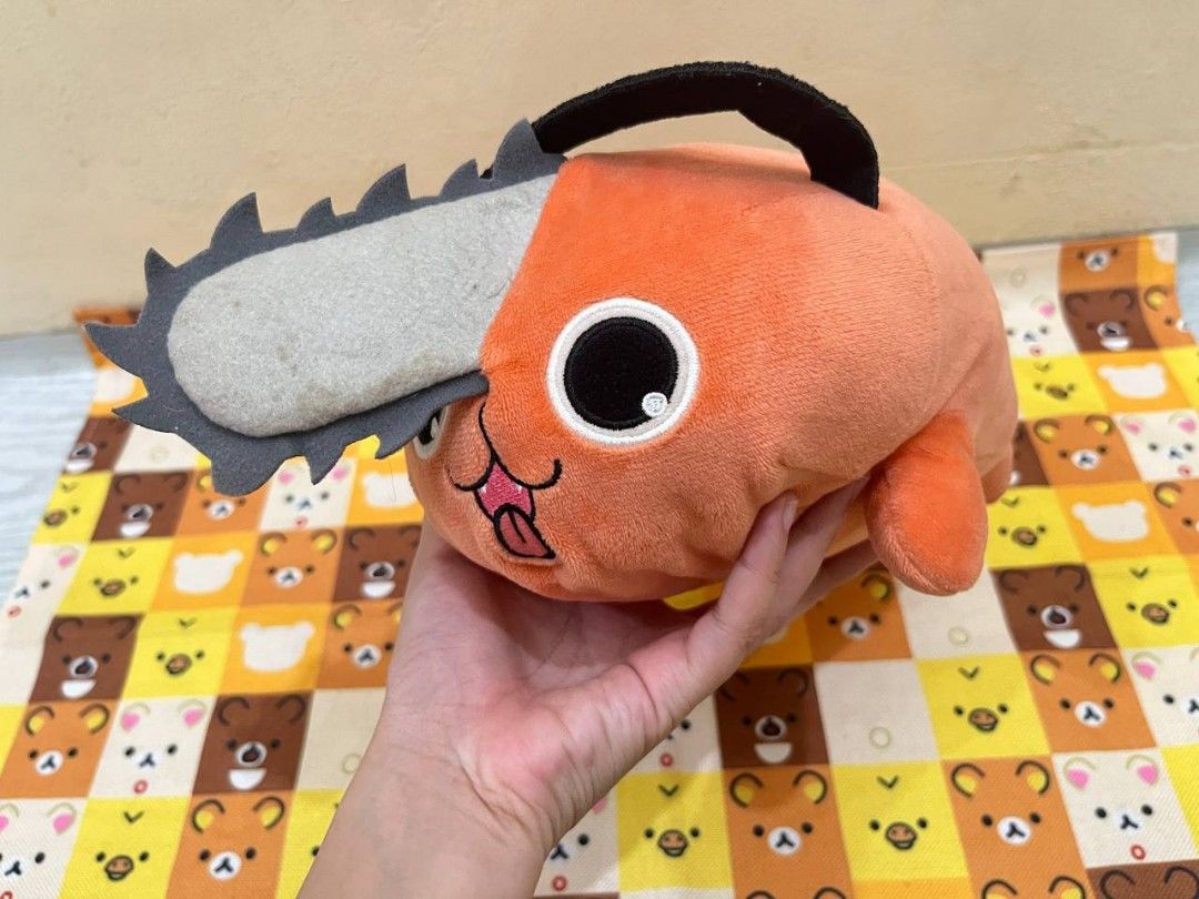 Chainsaw Man Pochita Plush Toy (Category: Plushies & Soft Toys) located in Bulacan. Submitted by arax_kumashop (Listing ID 1439673573, Image 1). Description: - Adorable Pochita plush toy from Chainsaw Man. - Features Pochita's signature chainsaw head and orange body. - Soft and huggable material. - Perfect for cuddling or display - Includes original tag. - A great addition to any anime collection! -bought 1k japan pasabuy.