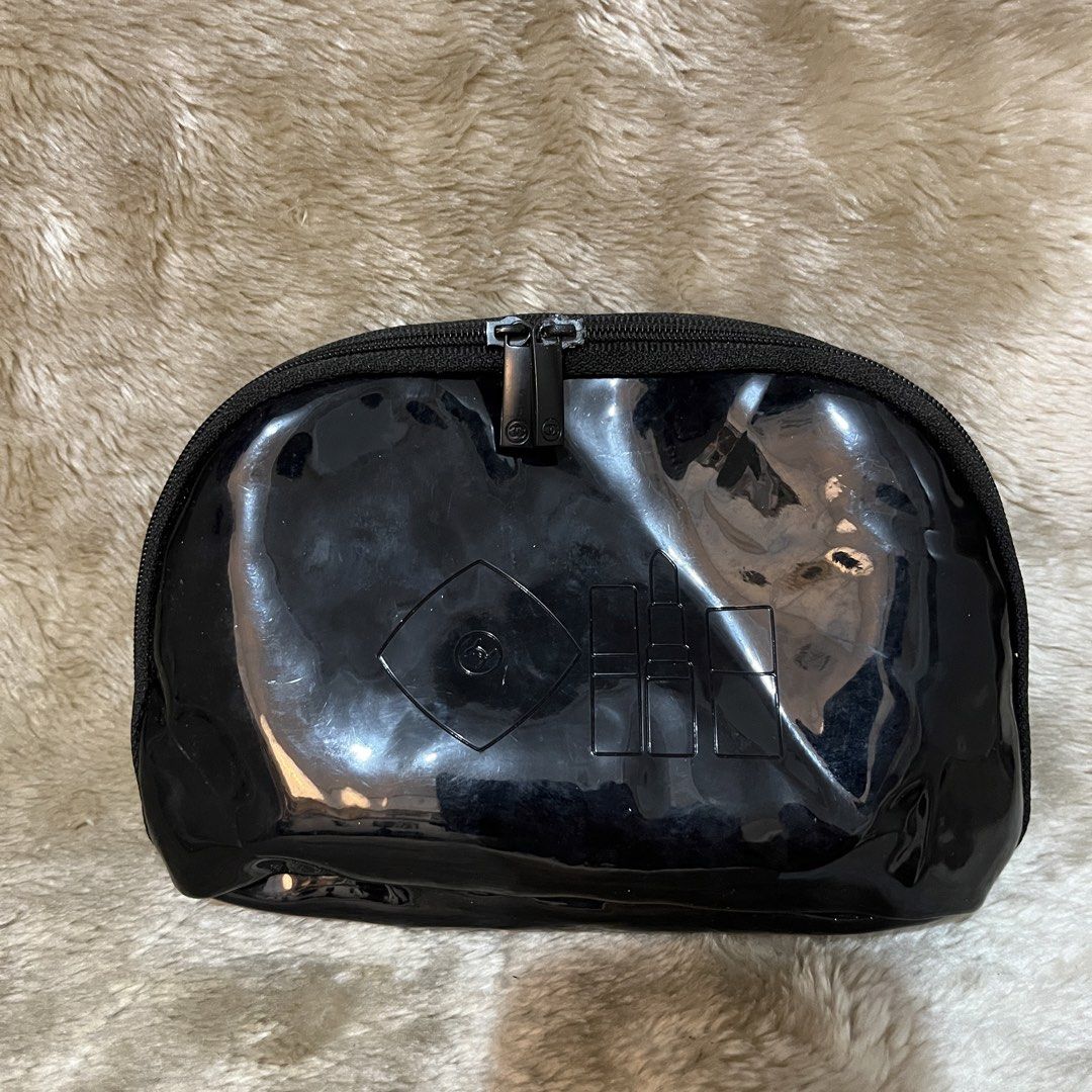 Chanel Maquillage Cosmetic Pouch (Category: Purses & Pouches) located in Cabadbaran. Submitted by dfgthriftology (Listing ID 1439638646, Image 2). Description: - Chanel Maquillage pouch - Glossy black exterior - Secure zipper closure - Rectangular shape - Dimensions: Approximately 7x4 inches - Features Chanel branding - Chanel logo on zipper.