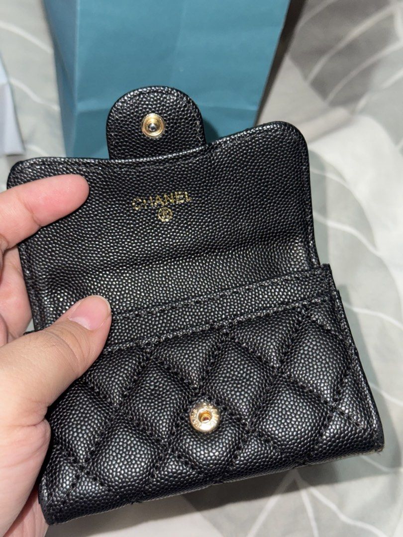 Class A Chanel Quilted Card Holder (Category: Luxury Bags & Wallets) located in Las Pinas. Submitted by bookoffmnl (Listing ID 1439754253, Image 3). Description: - Class A Chanel card holder - Bought from Ho Chi Minh, Vietnam - Black quilted leather - Gold-tone Chanel logo - Flap closure with snap - Interior compartment with embossed Chanel logo - Compact design for cards and cash.