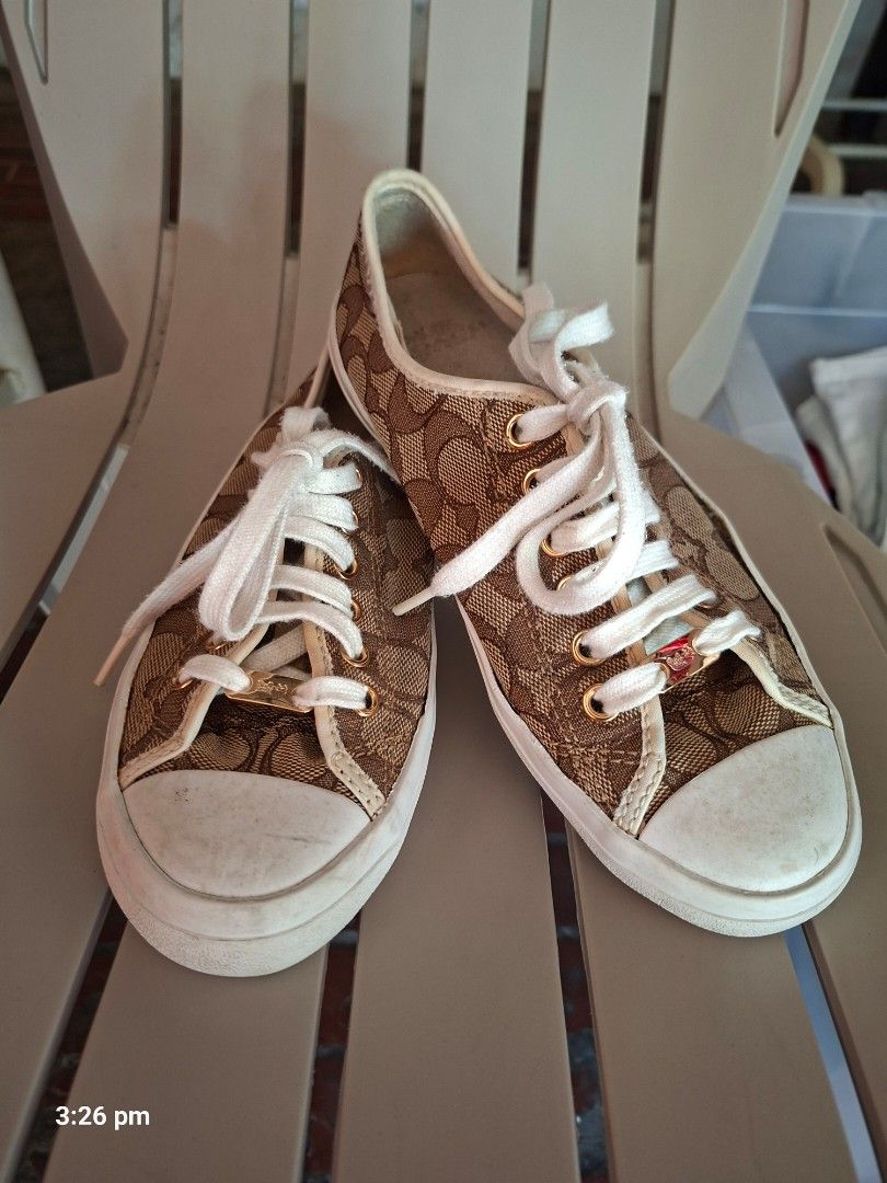Coach Signature Sneakers (Category: Sneakers) located in Paranaque City. Submitted by chebureche (Listing ID 1439679318, Image 1). Description: - Coach sneakers - Signature brown and white pattern - White laces and sole - Gold eyelets - Coach logo on sole - White interior.