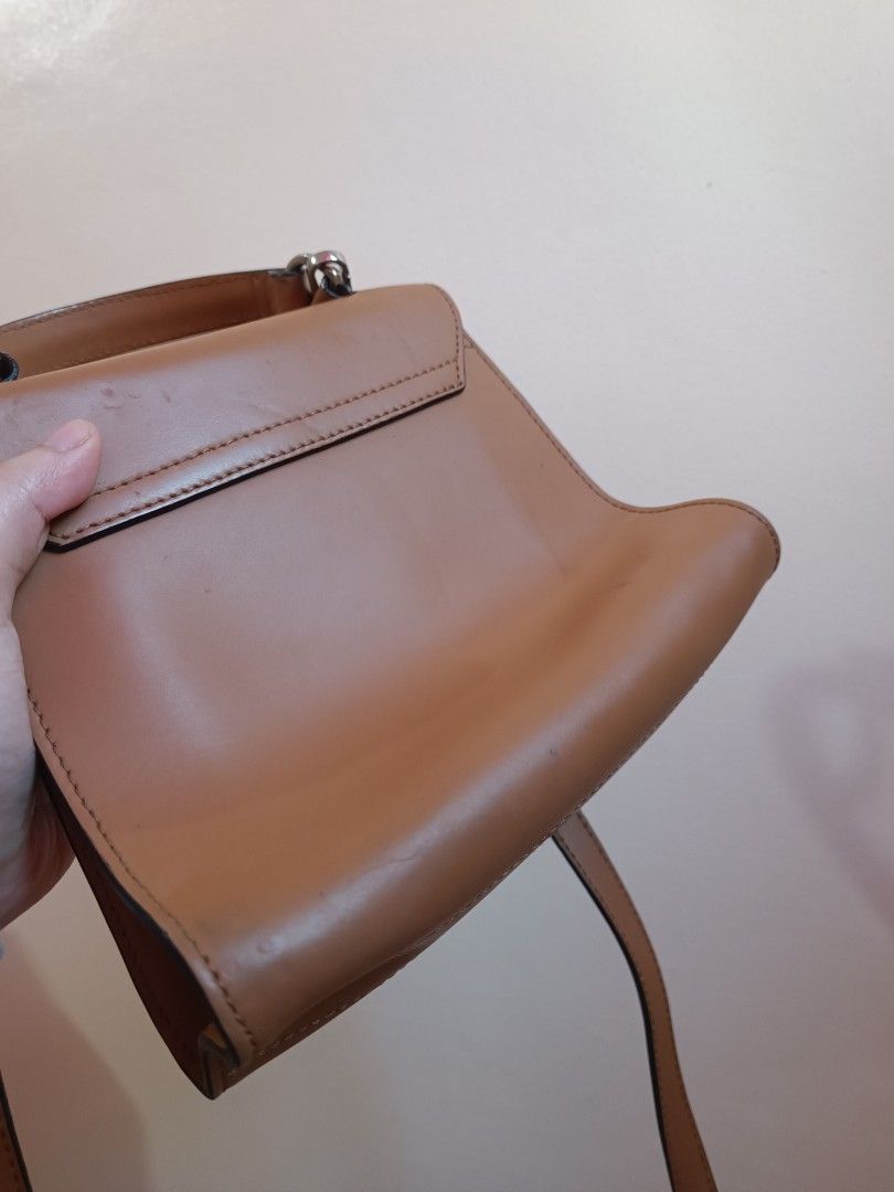 RUSH SALE Coccinelle bag (Category: Cross-body Bags) located in Paranaque City. Submitted by earlylux (Listing ID 1439656412, Image 3). Description: Please inspect photos for signs of usage/flaw No inclusions! Normal signs of usage please manage your expectations you're buying a secondhand bag. Pm for more details No return, no refund, no exchange, no cancellation! First to pay Joy miners will be blocked! MOP: Payment first gcash MOD: J&T and Lal