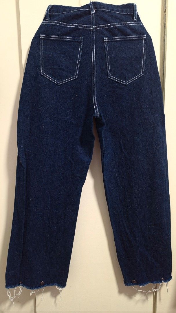 Cofee Dark Wash Jeans / Barrel Pants (Category: Jeans) located in Pasig City. Submitted by kmfad (Listing ID 1439737204, Image 2). Description: - Coffee brand, barrel pants dark wash jeans - White stitching details - Raw hem with button clasp to tighten the ends - Zipper closure - Two front pockets, two back pockets - Really nice stitching and fits 23-27" (see when worn pics) - Trendy and versatile style .