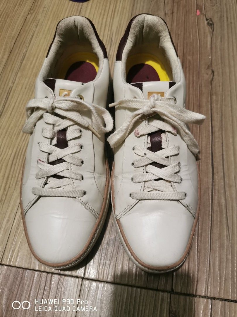 Cole Haan Sneakers W28624, 9b (Category: Sneakers) located in Makati City. Submitted by relianzmae57131 (Listing ID 1439638238, Image 1). Description: - Cole Haan sneakers - Color: White with brown accents - Closure: Lace-up - Size: 9B - Made in Vietnam - Insole: Yellow and burgundy - Sole: Brown.