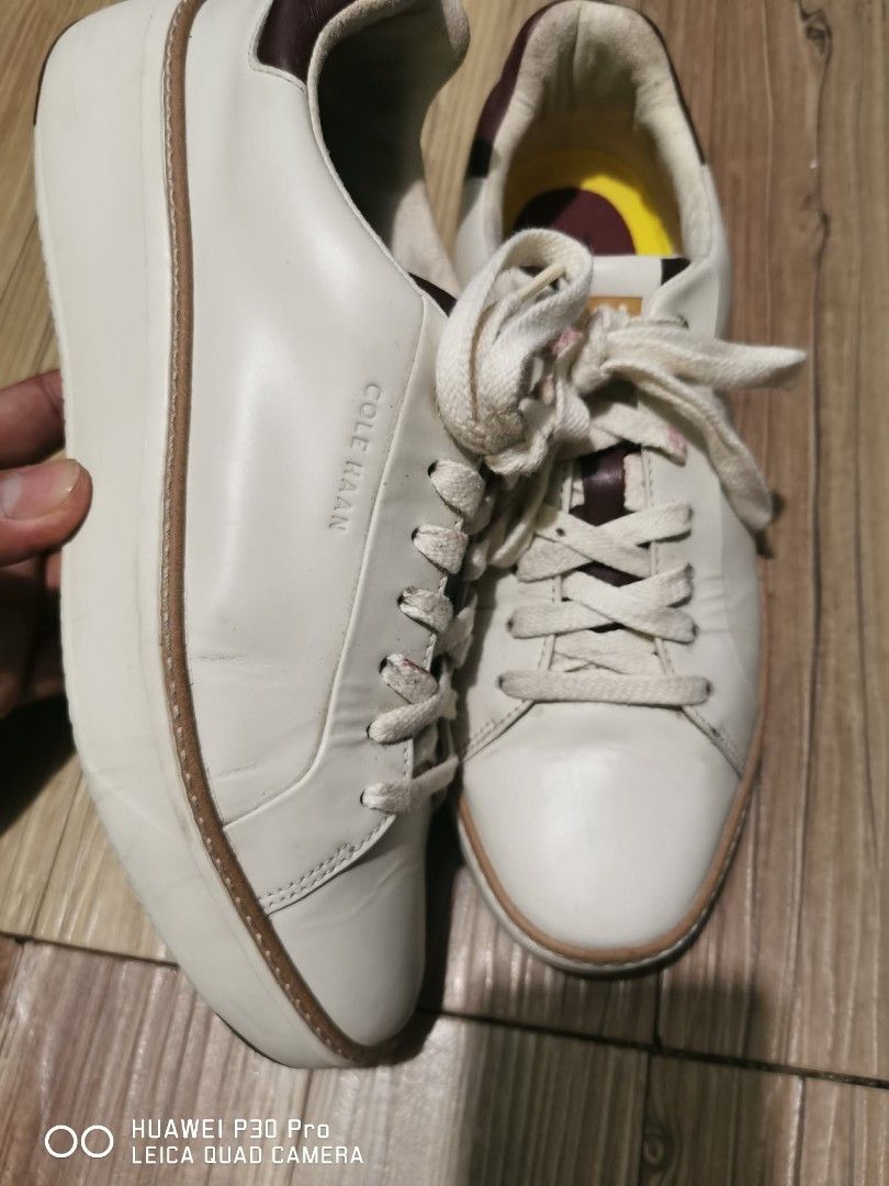 Cole Haan Sneakers W28624, 9b (Category: Sneakers) located in Makati City. Submitted by relianzmae57131 (Listing ID 1439638238, Image 3). Description: - Cole Haan sneakers - Color: White with brown accents - Closure: Lace-up - Size: 9B - Made in Vietnam - Insole: Yellow and burgundy - Sole: Brown.