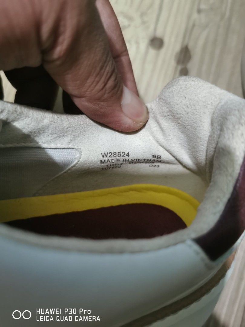 Cole Haan Sneakers W28624, 9b (Category: Sneakers) located in Makati City. Submitted by relianzmae57131 (Listing ID 1439638238, Image 2). Description: - Cole Haan sneakers - Color: White with brown accents - Closure: Lace-up - Size: 9B - Made in Vietnam - Insole: Yellow and burgundy - Sole: Brown.