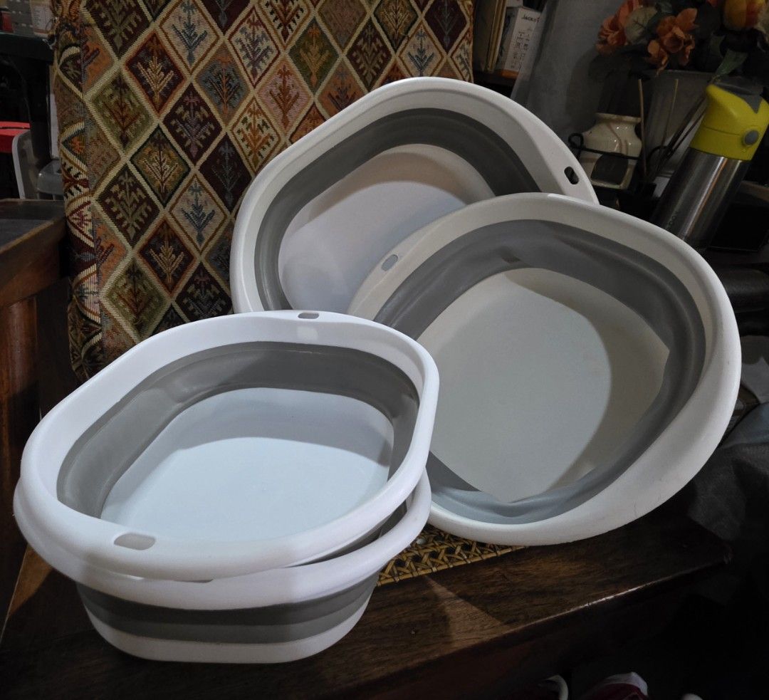 Collapsible Basin Set - 3 Pieces (Category: Cleaning Tools & Supplies) located in Manila. Submitted by pre.loved.declutterx (Listing ID 1439624773, Image 2). Description: - Set of four collapsible basins - Sizes: 1 large, 1 medium, 1 small - Color: White with gray accents - Condition: Used, but well-maintained - Perfect for various household tasks - Price: P200 for all.