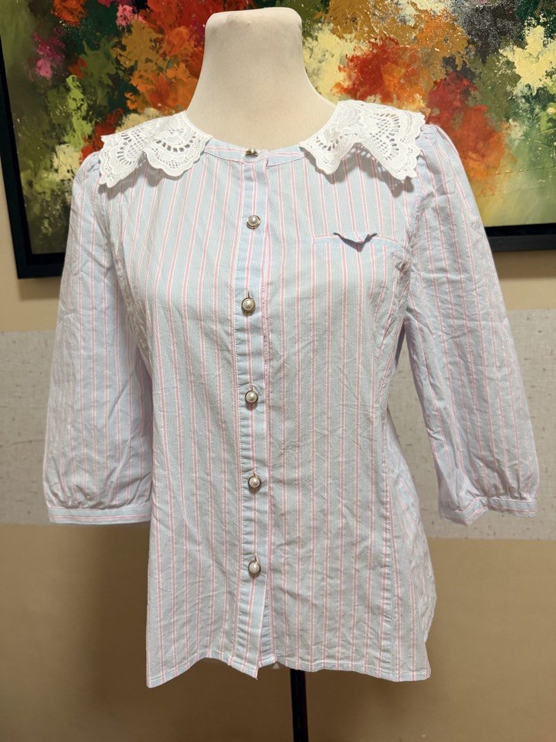 Cotton button up blouse (Category: Blouses) located in Muntinlupa City. Submitted by gap0710 (Listing ID 1439665940, Image 1). Description: Cotton button up blouse w/ decorative pearl buttons. In very good condition. .