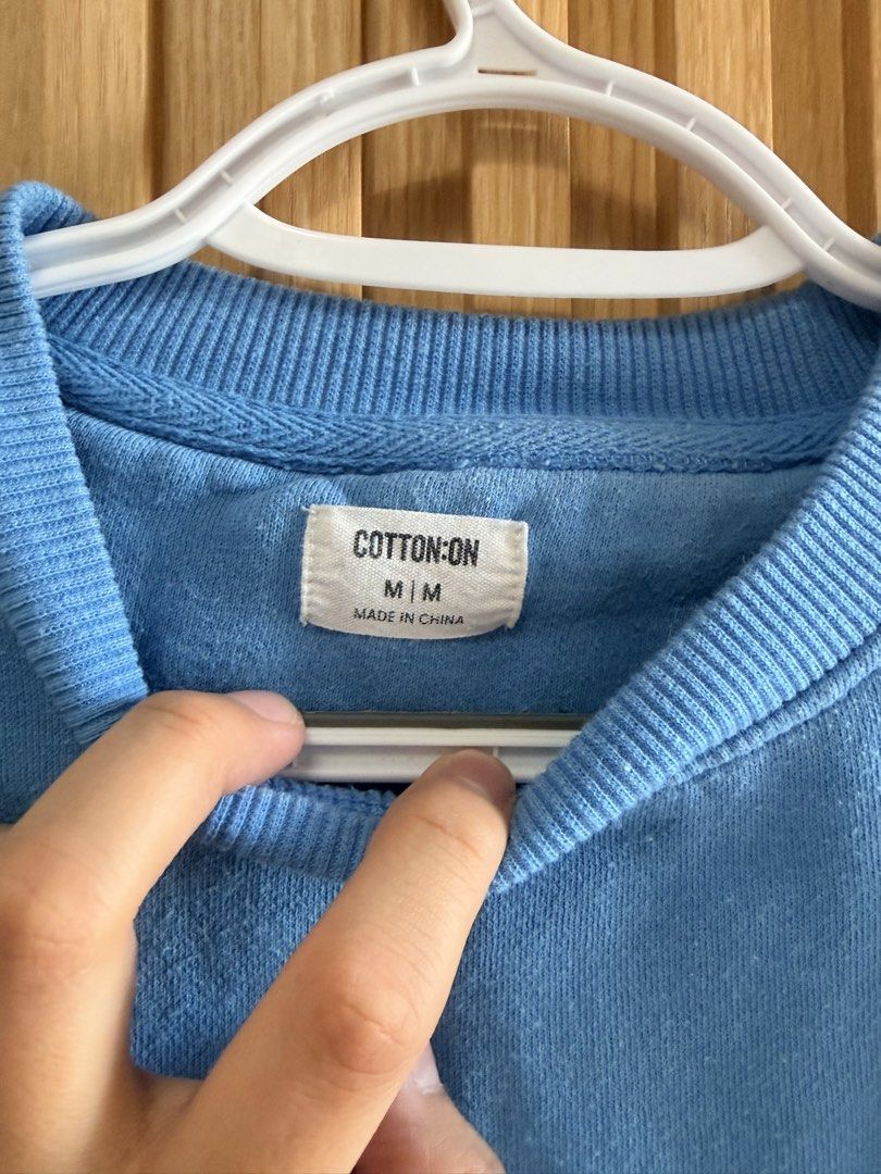 Cotton On Blue Sweatshirt - Size M (Category: Tshirts & Polo Shirts ) located in Cebu City. Submitted by dominicviado (Listing ID 1439686527, Image 2). Description: - Cotton On sweatshirt - Size: M - Color: Light Blue - Features: Crew neck, long sleeves - Made in China - Perfect for casual wear.
