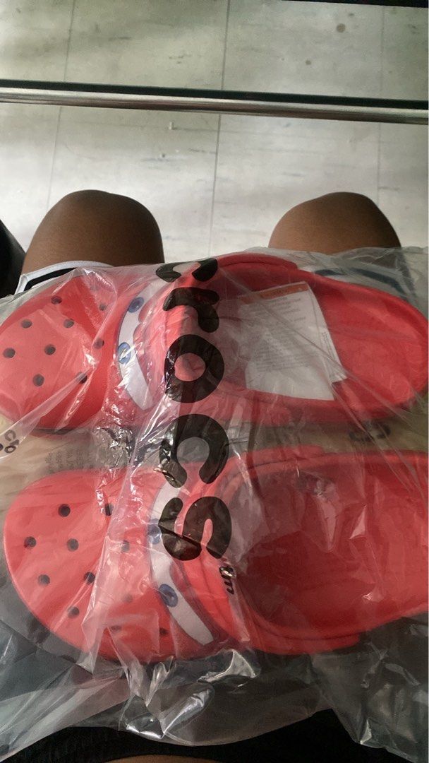 Crocs Lightning McQueen Sandals (Category: Slippers & Slides) located in Bulacan. Submitted by trada007 (Listing ID 1439649547, Image 1). Description: - Brand new Red Crocs sandals - Features Lightning McQueen design - Includes the number 95 and other graphics - Classic Crocs design with ventilation holes - Comes in original packaging.