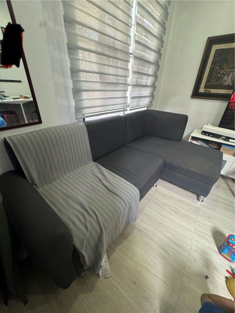 Dark Grey L-Shaped Sofa (Category: Sofas) located in Cavite. Submitted by preloved_mommyandkidsph (Listing ID 1439694289, Image 2). Description: - Dark grey L-shaped sofa - Features a chaise lounge - Includes a light grey blanket - Modern design with metal legs - Comfortable seating - Stylish look For pick up only at carmona cavite - Perfect for living rooms or lounges.
