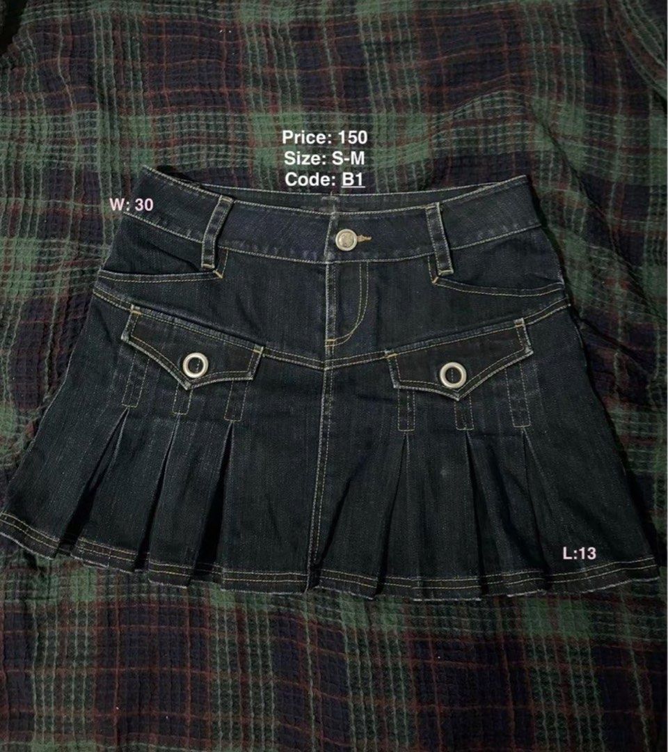 Dark Wash Denim Pleated Skirt (Category: Skirts) located in Marikina City. Submitted by d.clutters (Listing ID 1439733328, Image 1). Description: - RFS: too big for me - Dark wash denim skirt - Pleated design - Features two front pockets with silver ring details - Waist: 30" - Length: 13" - Perfect for casual wear.