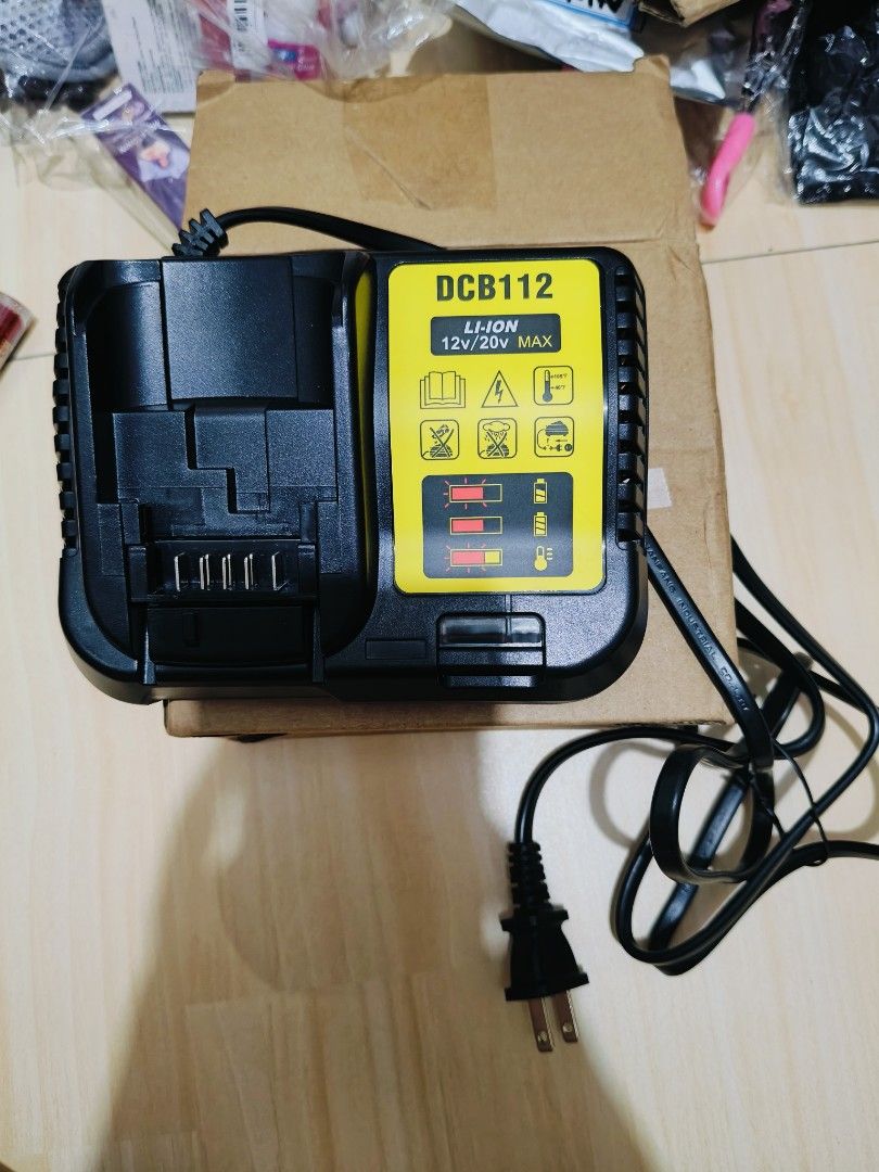 DCB112 Li-Ion 12V/20V Max Charger (Category: Chargers) located in Pasay City. Submitted by annfelblairtogado (Listing ID 1439759385, Image 1). Description: - Compatible with 12V/20V Max Li-Ion batteries - Includes power cord - Features charging status indicator lights - Color: Black and yellow.