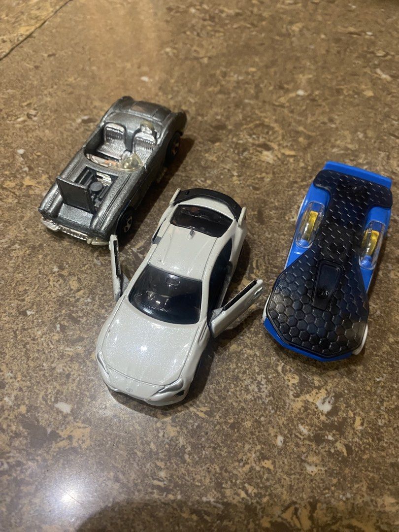 Diecast Toy Cars Assortment (Category: Vehicle & Diecast Models) located in Binan City. Submitted by maggierabi01434 (Listing ID 1439658942, Image 1). Description: - 3 for Php 150 - Assortment of diecast toy cars. - Features various models and designs. - Suitable for collectors and kids. - Detailed designs and features. - Great addition to any car collection..