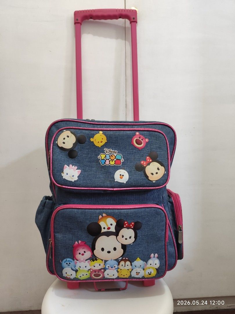 Disney Tsum Tsum Rolling Backpack / Stroller Bag (Category: Babies & Kids Fashion) located in Paranaque City. Submitted by ipuno_ (Listing ID 1439637357, Image 1). Description: - Denim rolling backpack with pink handle and trim. - Adorned with adorable Disney Tsum Tsum characters. - Multiple compartments for organized storage. - Designed for kids. - Ideal for school or travel use. IN VERY GOOD CONDITION. Lightly used. RFS : Decluttering MOP : BDO