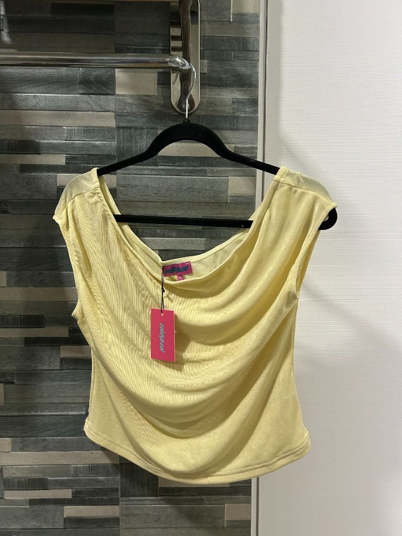 Edikted Pastel Yellow Asymmetric Top (Category: Sets or Coordinates) located in Bacolod City. Submitted by seraphimsangels (Listing ID 1439653932, Image 1). Description: - Edikted Asymmetric Top - Color: Yellow - Material: Polyester, Rayon, Spandex - New, With Tags https://edikted.co.uk/products/s17053_yellow.
