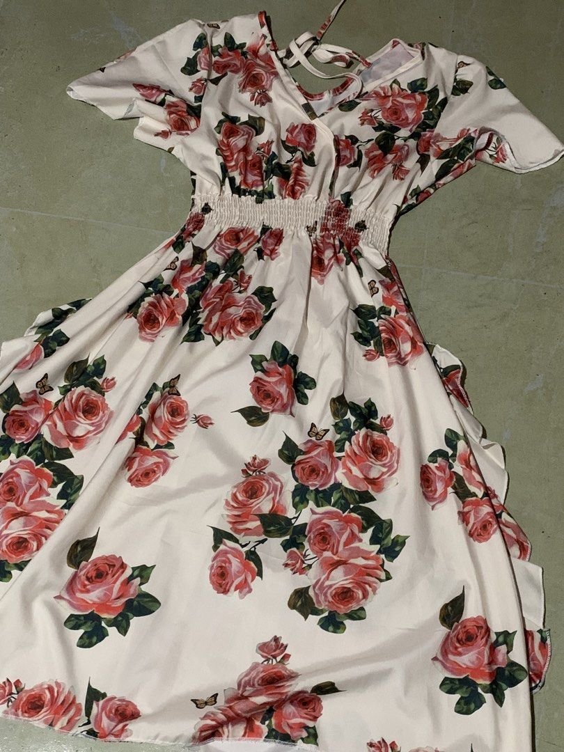 Floral Print Dress (Category: Dresses) located in Manila. Submitted by sammmyyy_oon (Listing ID 1439687878, Image 2). Description: - Floral print with rose design - V-neckline - Short sleeves - Elastic waist - Flowing skirt - Tie-back detail - Suitable for casual and special occasions.
