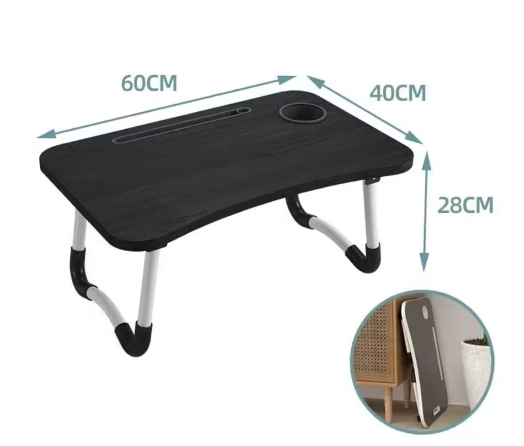 Foldable Laptop Table with Cup Holder (Category: Tables & Sets) located in Pasay City. Submitted by drogon234 (Listing ID 1439708083, Image 1). Description: - Foldable laptop table for comfortable work or study. - Built-in cup holder. - Tablet/phone slot. - Stylish black table with white legs. - Folds flat for easy storage. - Dimensions: 60cm x 40cm x 28cm..
