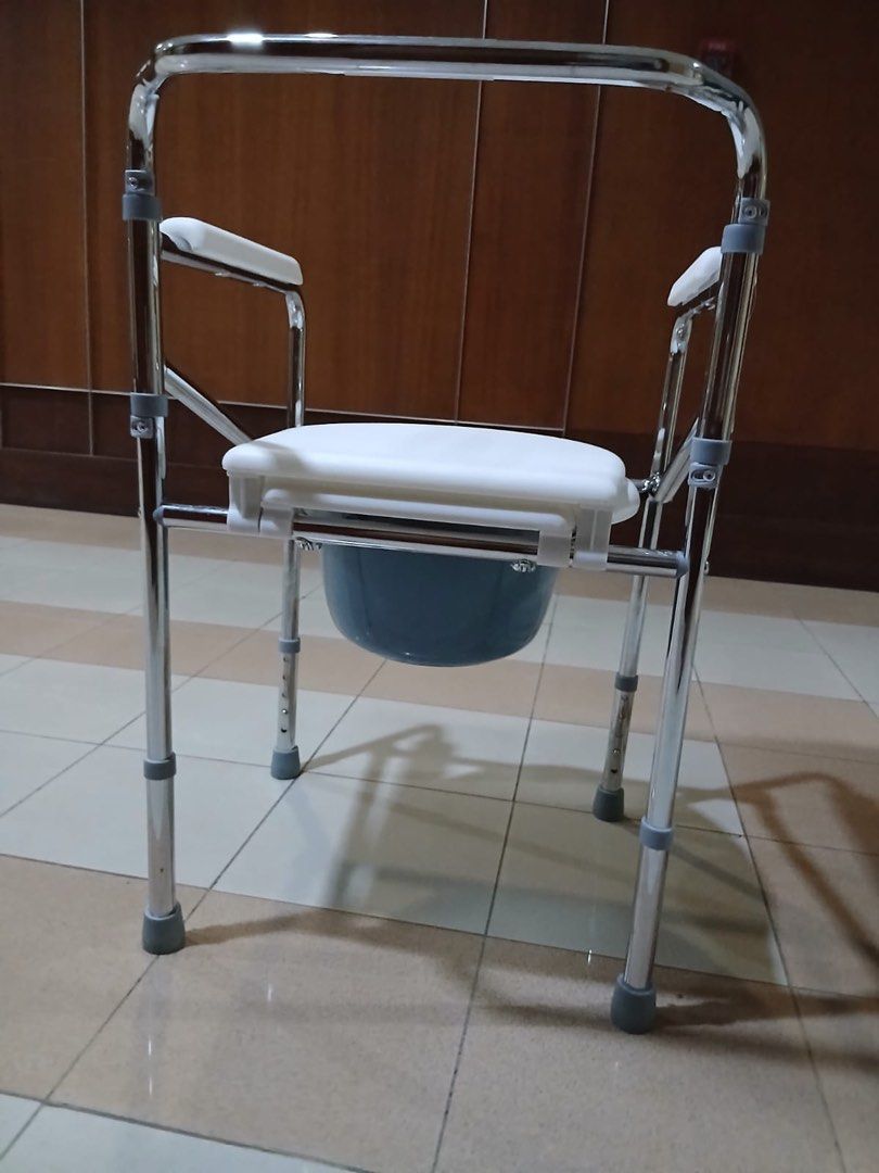 Folding Commode Chair with Bucket (Category: Medical Supplies & Tools) located in Quezon City. Submitted by sairylpali (Listing ID 1439691015, Image 3). Description: - Sturdy chrome frame - Comfortable white seat - Removable blue bucket for easy cleaning - Includes armrests for added support - Designed for convenience and ease of use - Suitable for individuals needing toileting assistance.