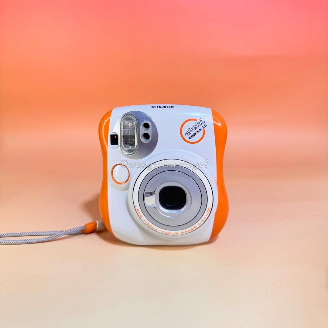 Fujifilm Instax Mini 25 Instant Camera (Orange) (Category: Cameras) located in Bulacan. Submitted by orangepixiestixgirl (Listing ID 1439750422, Image 1). Description: ‼️message me on ig, @orangepixiestixgirl for inquiries and transactions‼️ ‼️CAN’T REPLY HERE‼️ Fujifilm Instax Mini 25 Instant Camera (Orange) —This camera has an automatic electronic flash and a programmed electronic shutter. —Flash and Zoom working. —Uses two CR2 battery —Uses Fu