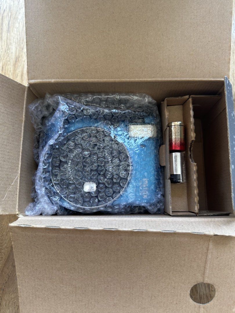 Fujifilm Instax Mini 70 Instant Camera (Category: Cameras) located in Manila. Submitted by ellie.copter (Listing ID 1439670829, Image 3). Description: - Fujifilm Instax Mini 70 instant camera (blue) - Includes original box, strap, and batteries - 60mm lens - Focus range: 0.3m - Features mode button and display screen - Film compartment accessible not properly tested, works with battery but lcd screen doesnt work - printing quality not tested with