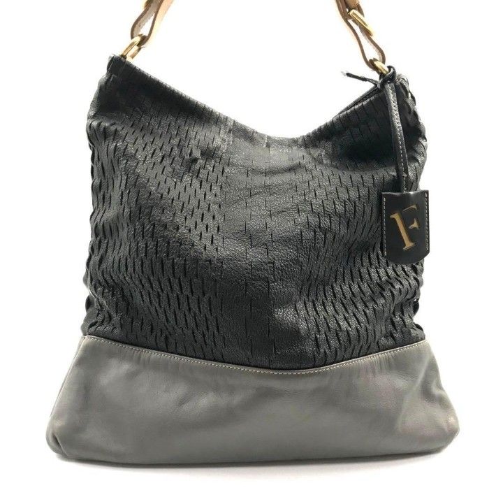 FURLA HOBO BAG (Category: Luxury Bags & Wallets) located in Cavite. Submitted by xjune8x (Listing ID 1439759432, Image 2). Description: FURLA THIS IS A BLACK AND GRAY FURLA HOBO SHOULDER BAG FEATURING A WOWAN UPPER PANEL AND SMOOTH LEATHER BASE. IT HAS MINOR FLAWS...